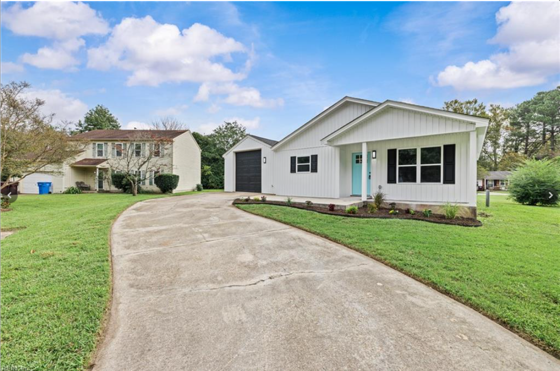 Same Hampton Roads house after full renovation — new roof, siding, and porch