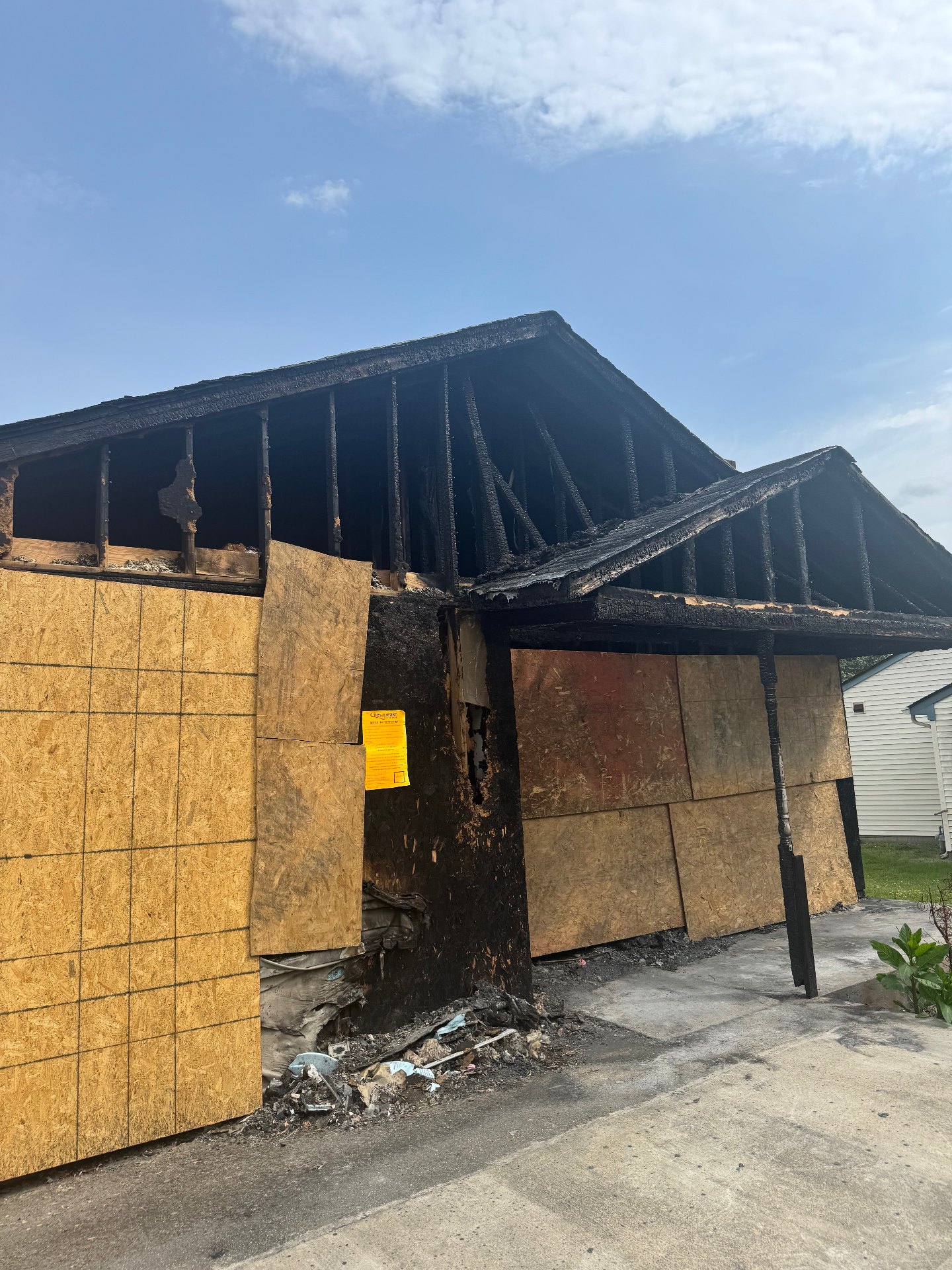 Fire damaged Chesapeake house boarded up with charred roof before we bought it