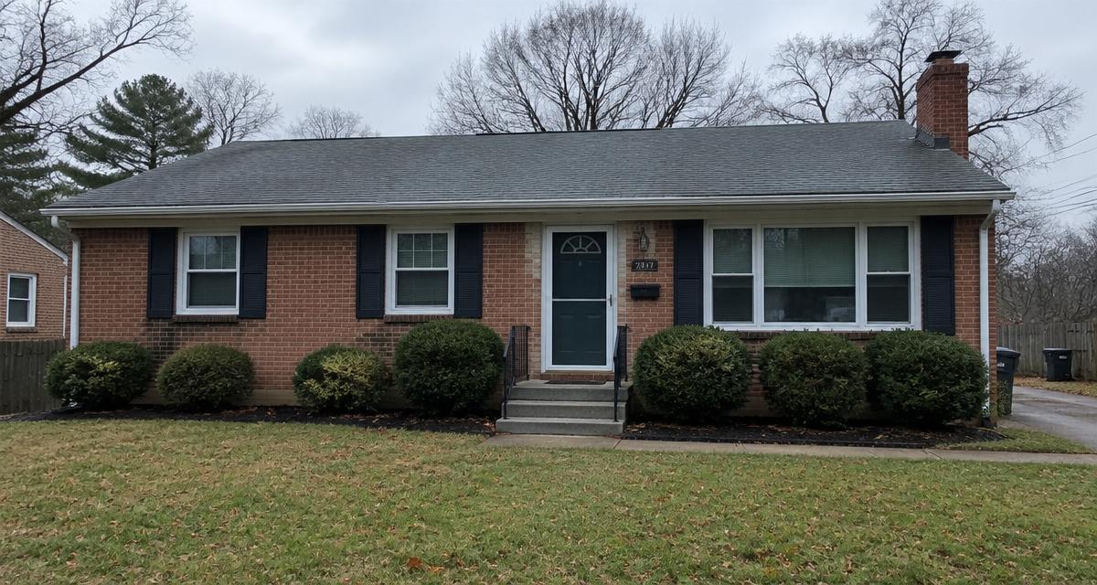 Brick ranch home in Virginia on an overcast day after a foreclosure sale