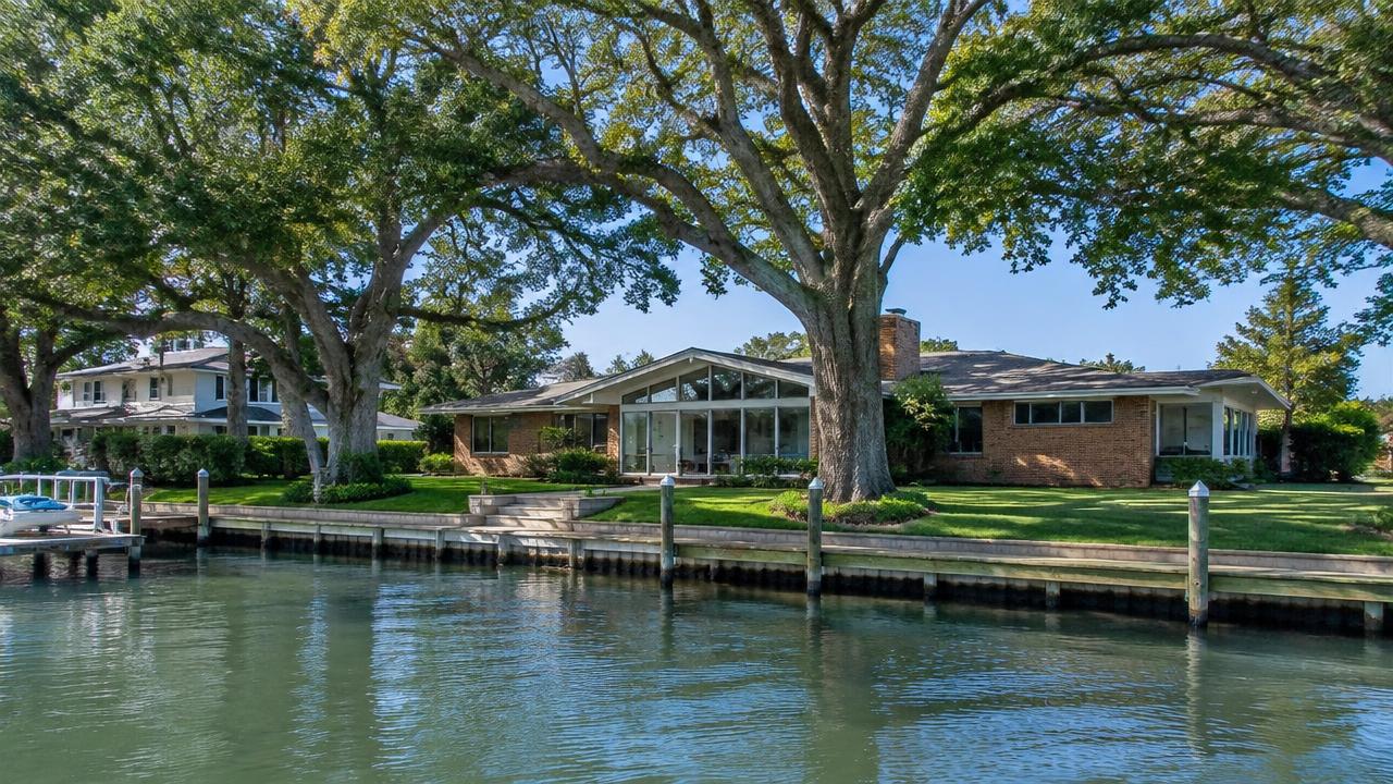Large mid-century waterfront home with mature oaks on a quiet canal street in Bay Colony, Virginia Beach, Virginia