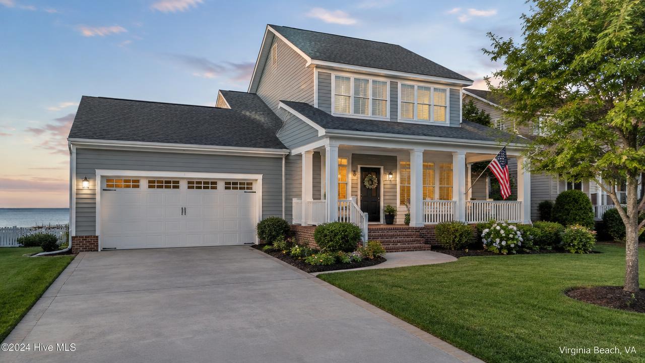 Suburban home near the coast with an American flag on the porch in Dam Neck, Virginia Beach, Virginia