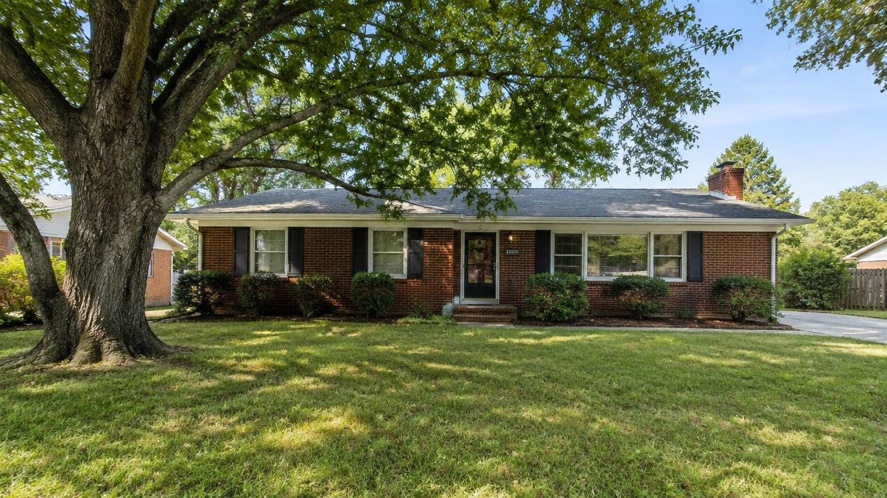 1960s brick ranch home with a wide front lawn and mature oak in Fordham, Hampton, Virginia