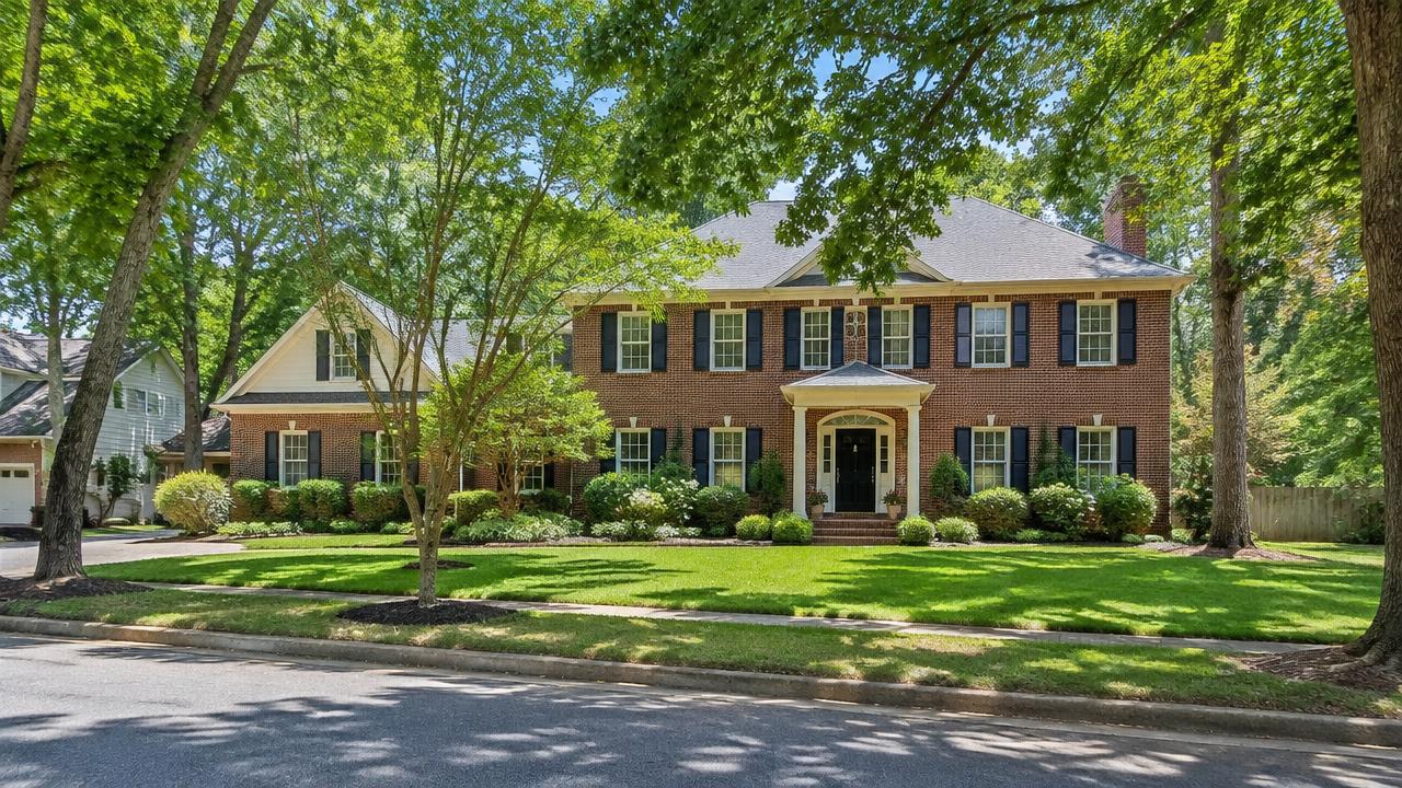 Stately brick colonial home with mature trees on a wide shaded street in Linkhorn Park, Virginia Beach, Virginia