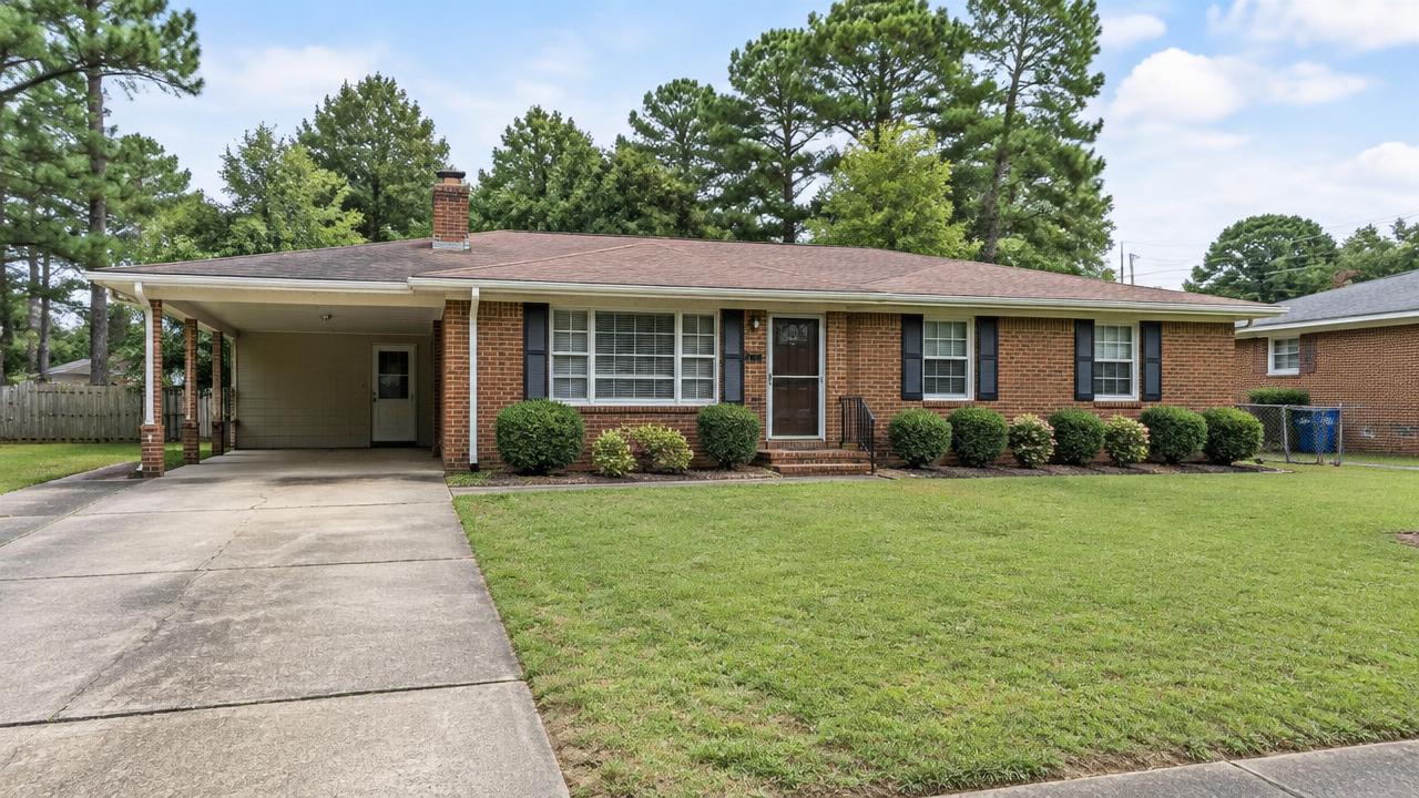 1970s brick ranch home with carport on a level suburban lot in Rosemont, Virginia Beach, Virginia