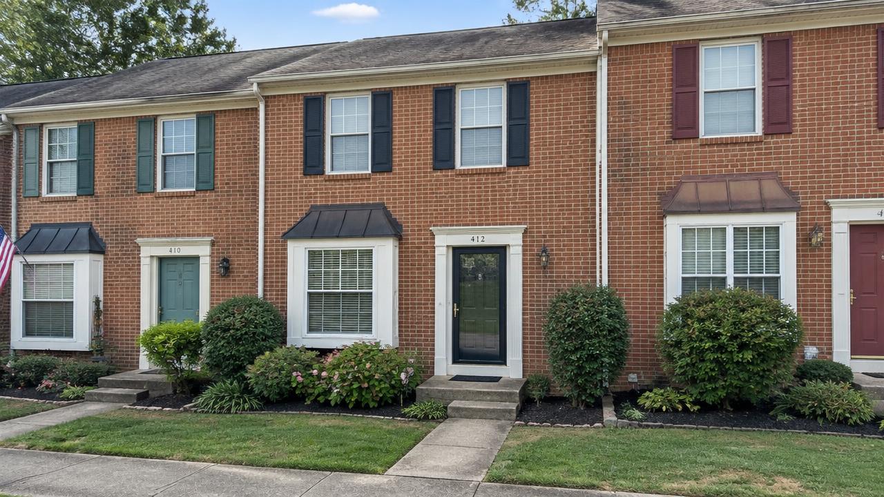 1980s townhome row with brick fronts and small front gardens in Sussex at Hampton, Hampton, Virginia